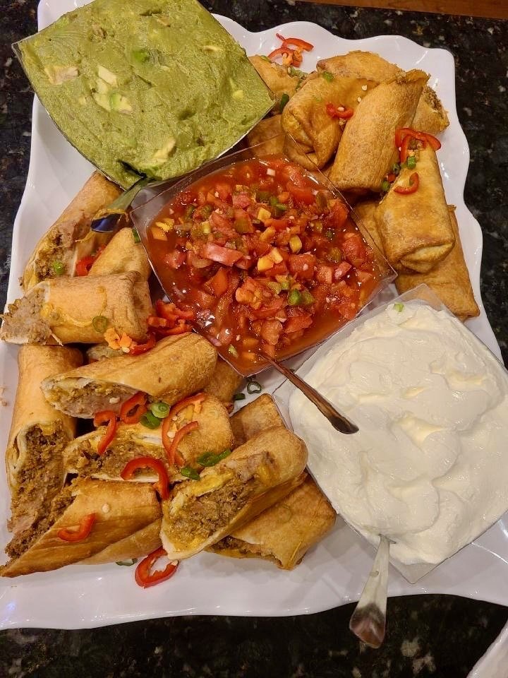 An appetizer platter with dips