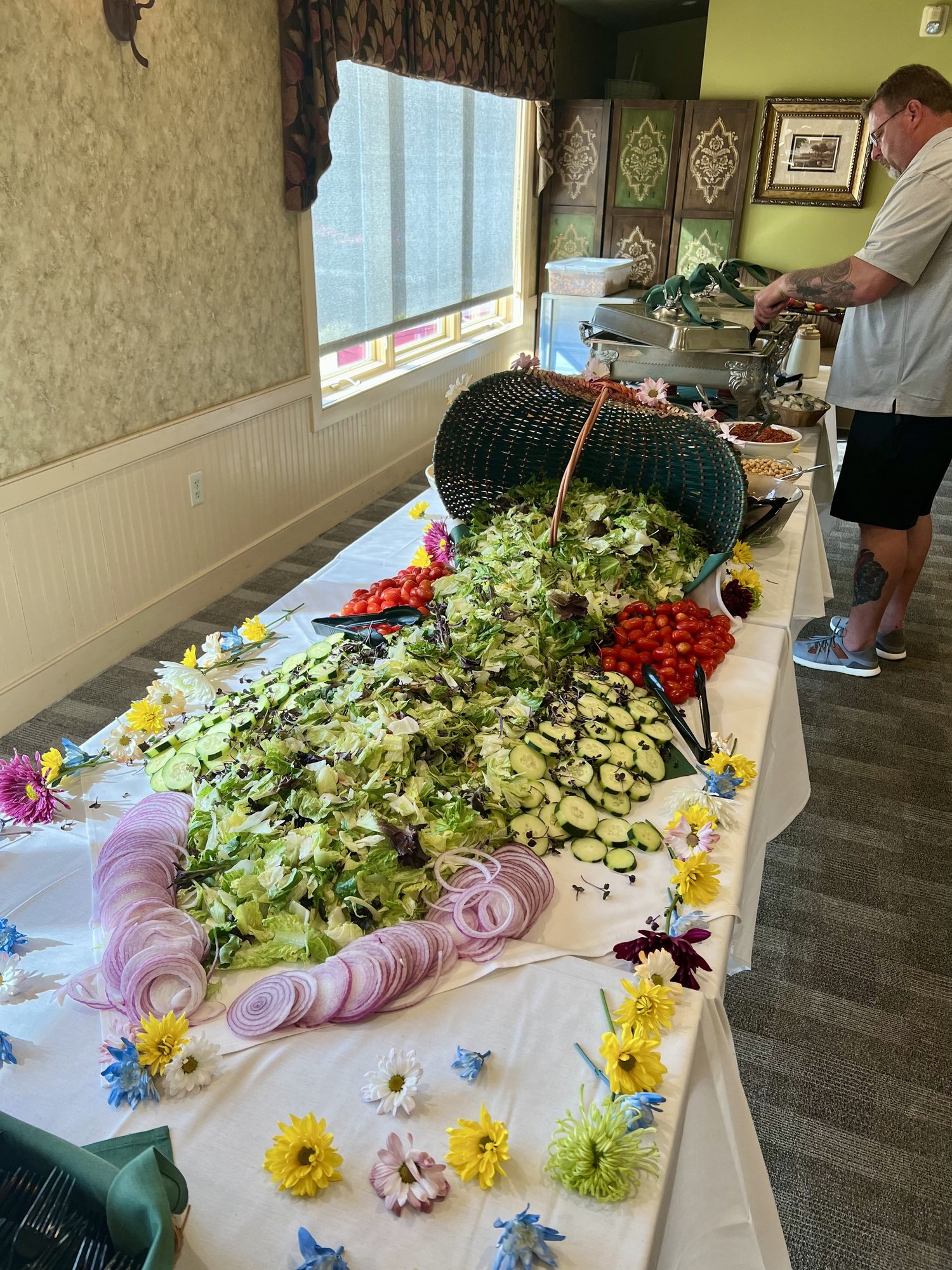 A fresh salad spread laid out for an event