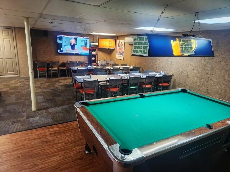 The game room with pool table and darts